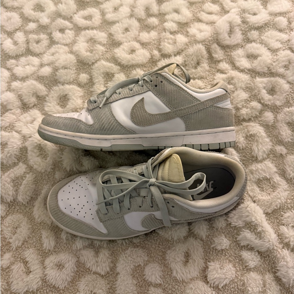woman’s green corduroy dunks